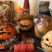 My work table holds four pumpkin gourds waiting for their Halloween hat. 